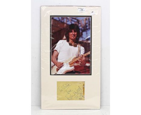 The Rolling Stones guitarist Ronnie Ron Wood - Signed and mounted display - Autographed by Ron Wood - It measures approx 12 i