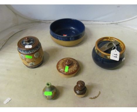 A Royal Doulton tobacco jar, bowl, pepper pot, teapot lid, miniature flask and lidded jar