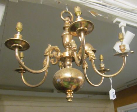 A brass six branch chandelier