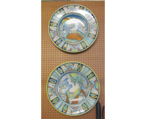 A pair of V. Umberta wall plaques portrait male and female