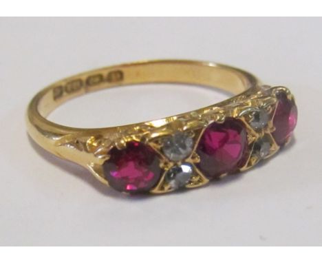 An 18ct gold synthetic ruby and diamond ring size L/M