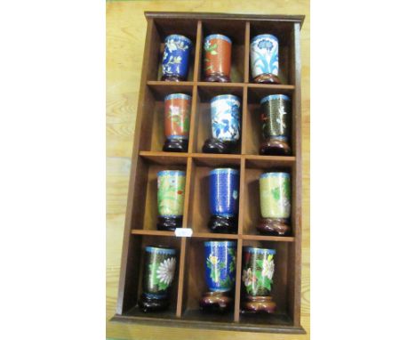 Twelve modern cloisonné beakers with stands on shelf