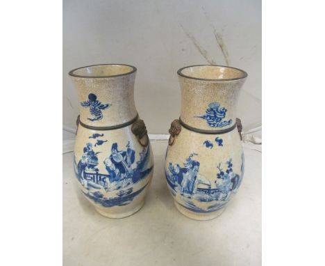 A pair of Chinese crackleware vases1.  Chip to foot on 1  was on image but did not mention 2.  just noticed Under blue light 