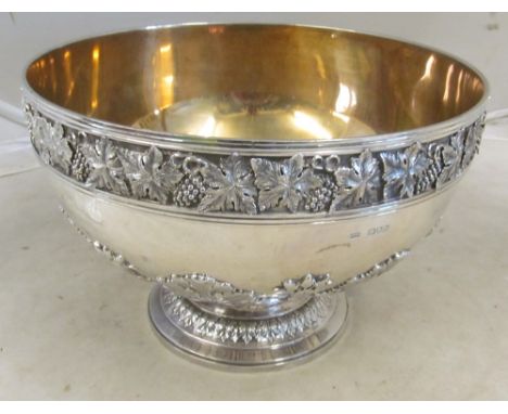 A silver punch bowl with grape and vine border approx 98 ozsYes gilt lined12" wide8" high About 3mm gaugeSeems ok slam scratc