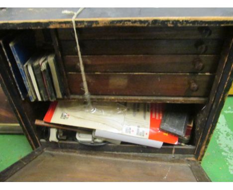 A vintage tool box with drop front revealing drawers together with various tools