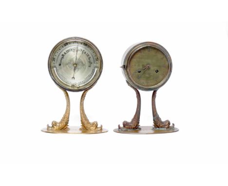 VICTORIAN CIRCULAR BAROMETER WITH THERMOMETER the engraved silverised dial contained in a brass case, on an oval base with up