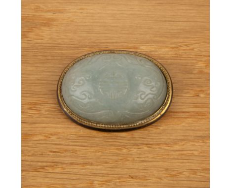 Large pale green oval mounted jade broochChinese, 18th/19th Centurycarved with a central shou character encircled by two drag