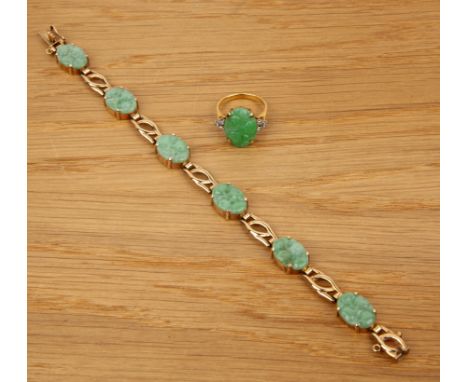 Two pieces of jade jewellery English, 20th Centurythe first a 9ct gold panel bracelet, set with six carved jade panels, 18cm 