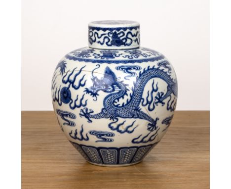 Ovoid blue and white vase and coverChinese, 19th Centurypainted with a dragon and flaming pearls, Kangxi mark to the base, 20