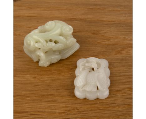 Two jade piecesChineseto include a rectangular weight carved with a fungus 5cm long and a white jade carved with a phoenix, 4