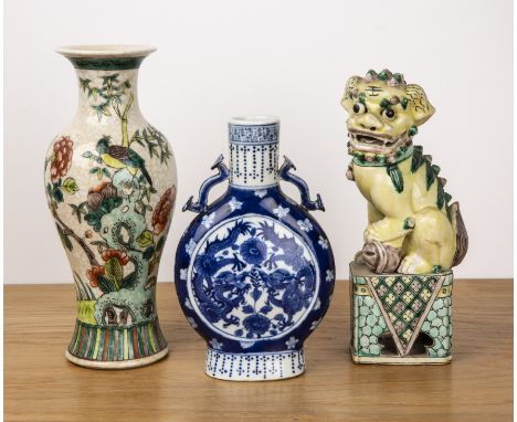 Three pieces of porcelainChineseincluding a famille verte temple dog, 24cm high, a blue and white moon flask, 20cm high, with