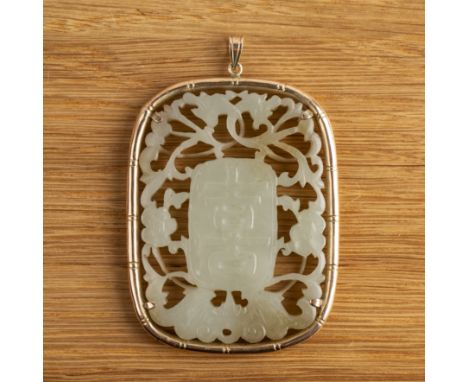 Oval jade carved pendantChinese, 19th Centurywith a central panel to each side with a Shou character, within an open carved b