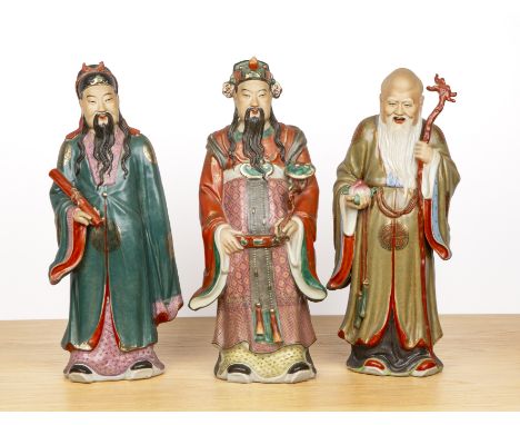 Three large porcelain figures of ImmortalsChinese, 20th Centuryincluding a model of Shou Lao holding a staff, each with an im