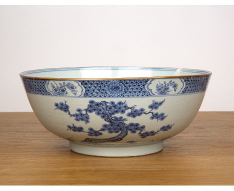 Blue and white porcelain bowlChinese, Kangxi periodpainted with a central spray of peonies, and further pine trees and flower