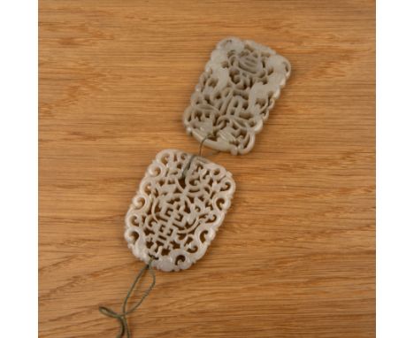 Pair of jade carved pendants Chinese, late 18th Centurygreyish white jade plaque pendants finely pierced and carved with vert
