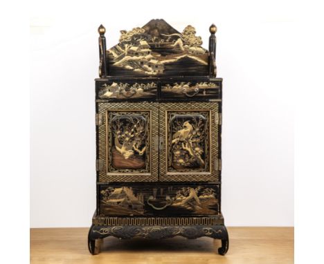 Black lacquer cabinet on standJapanesethe piece with two central doors, the doors opening to reveal six interior drawers, the