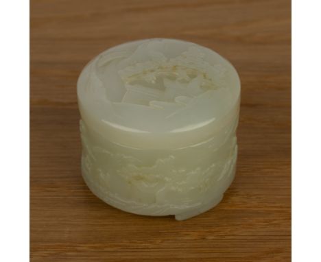 Jade small box and coverChinesecarved with a landscape scene, figures and pavilions, on three feet 5.5cm diameter x 4.3cm hig