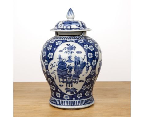 Blue and white porcelain vase and coverChinese, 19th Centurypainted with panels of 'antiques' within a blue ground of prunus 