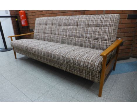 A teak and upholstered sofa day bed 