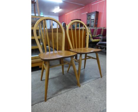 A pair of Ercol Golden Dawn elm and beech Windsor chairs 