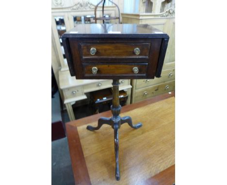 A Regency mahogany two drawer drop-leaf table on later tripod stand, 72cms h 