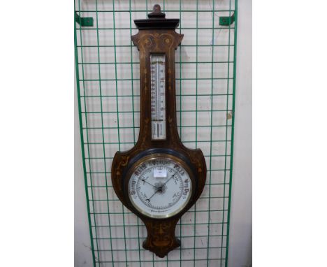 An Edward VII rosewood and marquetry inlaid shield shaped aneroid barometer 