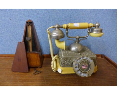 A vintage telephone, metronome, etc. 