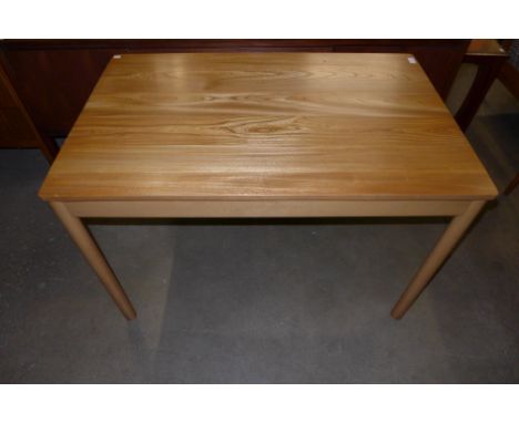 An Ercol Blonde ash and beech kitchen table 