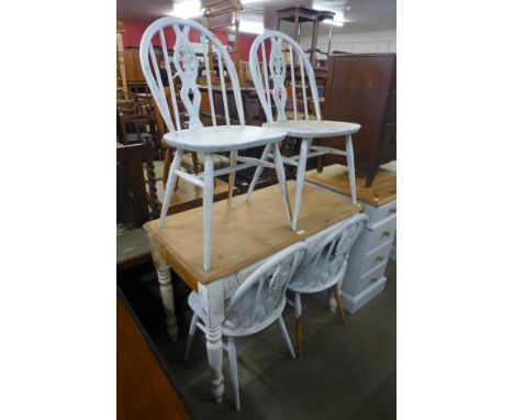 A set of four painted Ercol chairs and a painted pine side table 