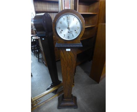 A walnut tapered dwarf longcase clock 