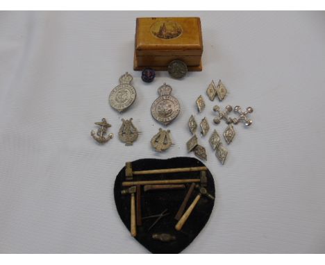 Mauchlin ware box and a collection of 18 boys brigade badges and a handmade plaque containing miniature tools