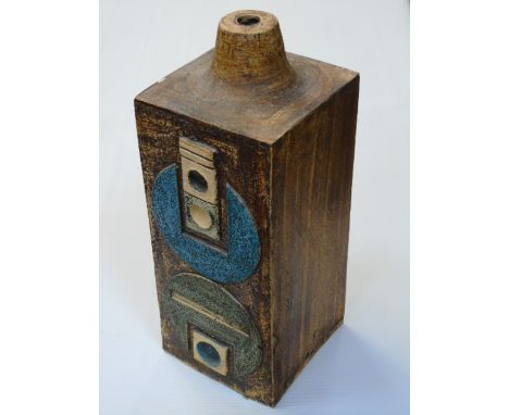 Troika lamp base by Avril Bennett with typical designs on a brown ground.  Approx 12 1/2" in height