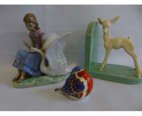 Royal Crown Derby figure of a bird with gold stopper. Nao figural group and a pottery bookend.