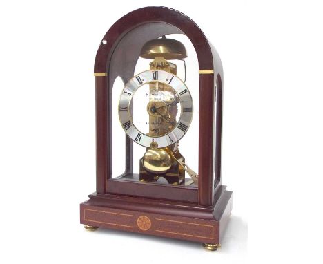 Sewills skeleton mahogany mantel clock, striking on a bell within an arched mahogany glazed case, 12" high (pendulum and wind