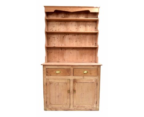 Stripped pine dresser, the open shelf back over two drawers and two panelled cupboards, 48" wide, 19" deep, 88" high approx