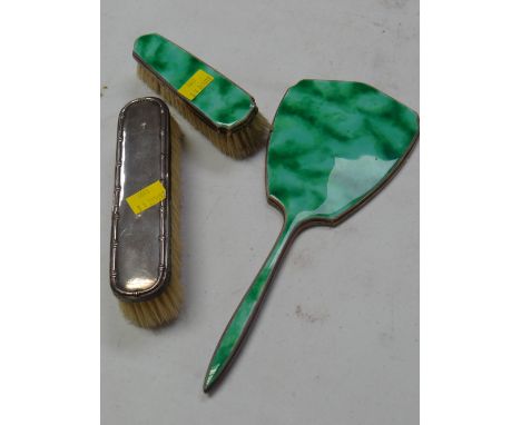 A silver & enamel back looking mirror & matching brush together with a silver back brush