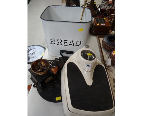 A vintage enamel bread bin, a vintage set of bathroom scales, coffee mill etc