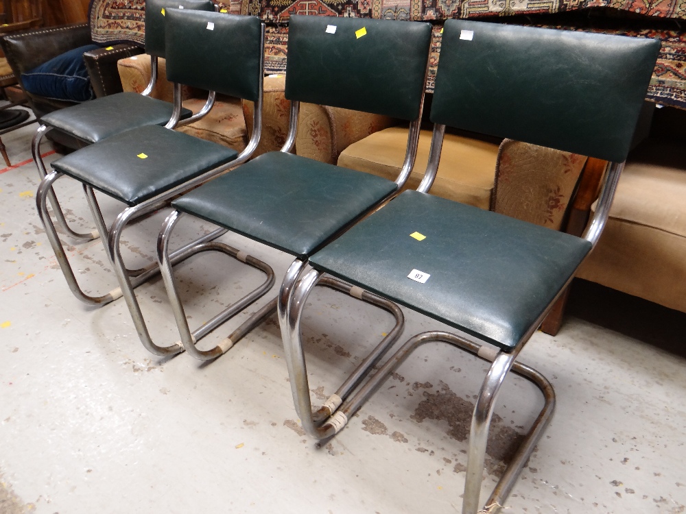A set of four retro chrome chairs with cushioned seats & backs