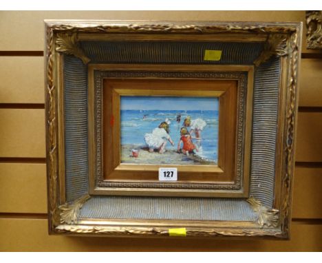 Framed oil on board by HAMILTON - beach scene with children playing on the shore