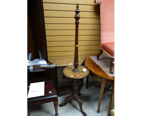 A tripod mahogany standard lamp with table / shelf