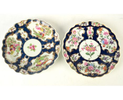 Two 18th century Worcester scale blue ground shaped plates, one with auricular at the centre surrounded by further flower pan