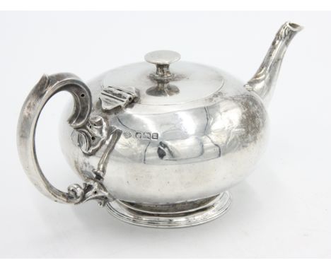 A fine plain silver bachelors teapot by William Hutton &amp; Sons Ltd with scrolling handle and reeded foot, Sheffield 1912, 
