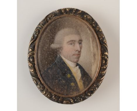 An 18th century portrait miniature of a young be-wigged gentleman with blue coat, 39 x 32mm.