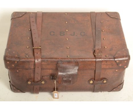 A Victorian brown leather trunk, initialled C.ST J.C., height 34cm, width 79cm, depth 50cm.