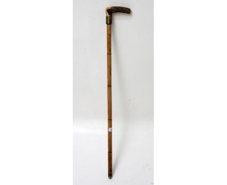 A bamboo cased sword stick, with antler handle, total length 96.5cm. Condition report: Lost its tip.