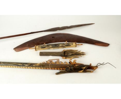 A tribal spear, with wooden handle and metal tip, length 157.5cm, a carved wood boomerang and an oriental blow pipe etc.