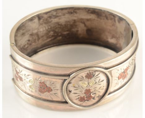 An Aesthetic Movement bangle. Condition report: Dents. Hinge and closure OK but bangle generally a bit tired.