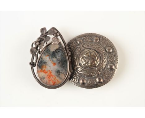 A Cornish Stone Company silver mounted moss agate brooch and a Celtic silver brooch.