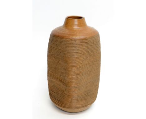 A Janet Leach saltglaze stoneware massive vase, with waisted cylindrical neck the cylindrical body compressed to form a squar