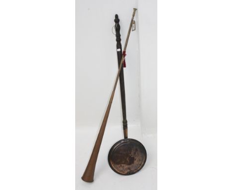 A large copper hunting horn, length 124cm and a Victorian copper warming pan.